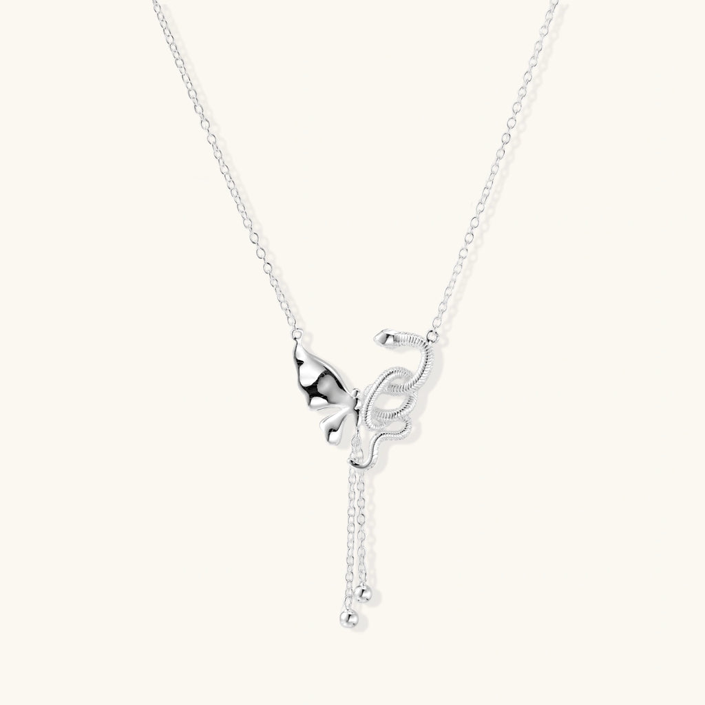Sterling silver butterfly pendant with textured wing detail on adjustable Y-chain with ball drop ends